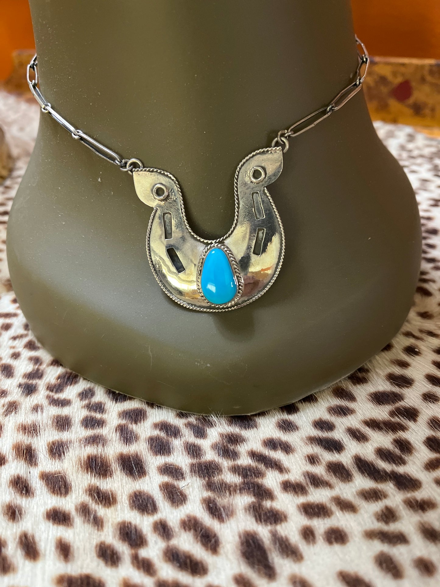 Horse shoe necklace.